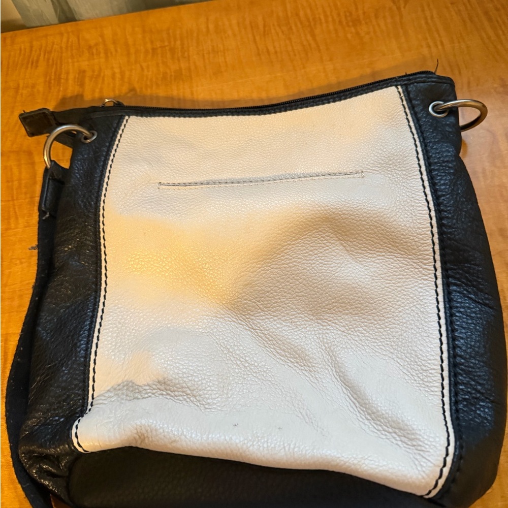 The Sak Laurel Crossbody Bag in a black, tan, and cream color-block design. - Picture 2 of 4